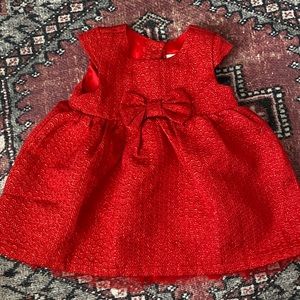 Red Shiny Baby Dress With Bow Detail.